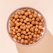 mymuesli Bio Zimt Pops in Schale mit Joghurt