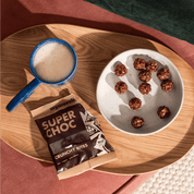 mymuesli Bio Crunchy Bites Super Choc Verpackung und auf dem Teller