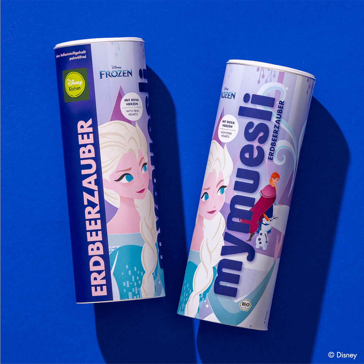 Zwei Disney Erdbeerzauber Müsli Dosen nebeneinander mit Elsa, Olaf und Anna im Design